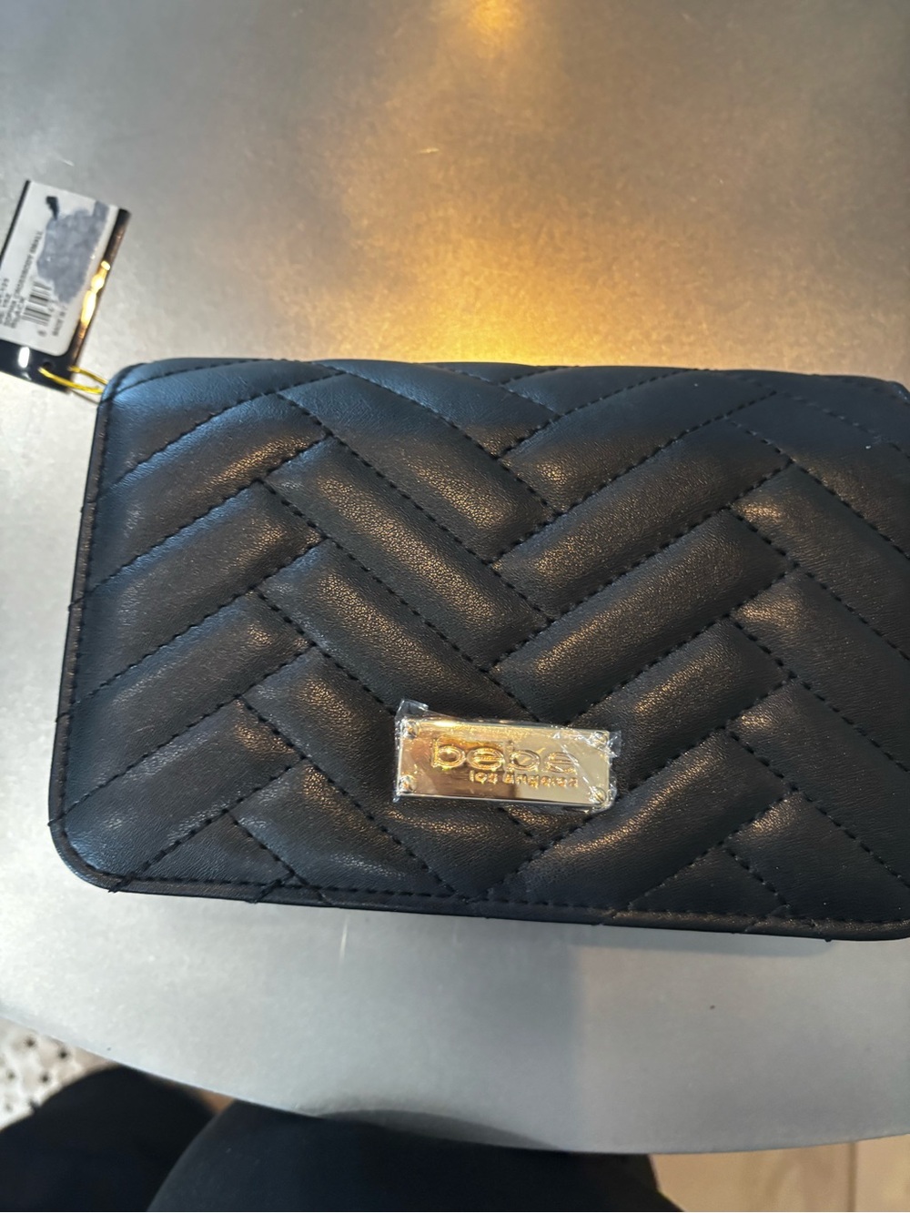 bebe Quilted Black Wristlet with Gold Logo Plaque
